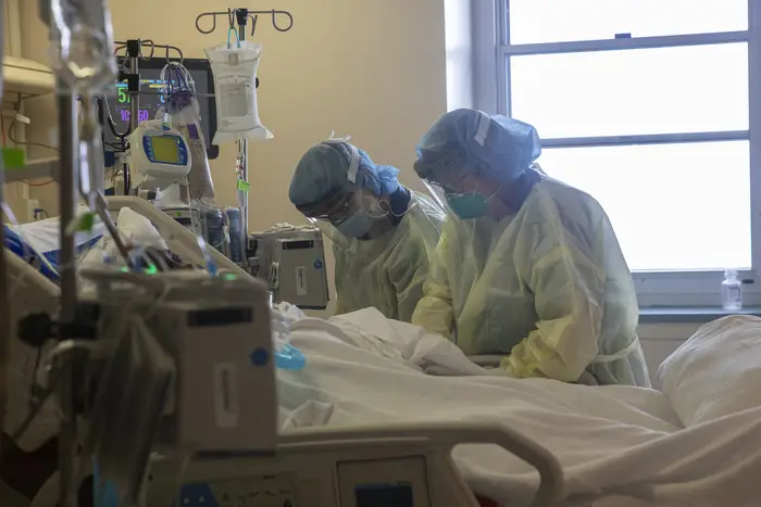 Two nurses assess the vital signs of a COVID-19 patient using a ventilator on the Intensive Care Unit (ICU) floor at the Veterans Affairs Medical Center on April 21, 2020 in the Brooklyn.